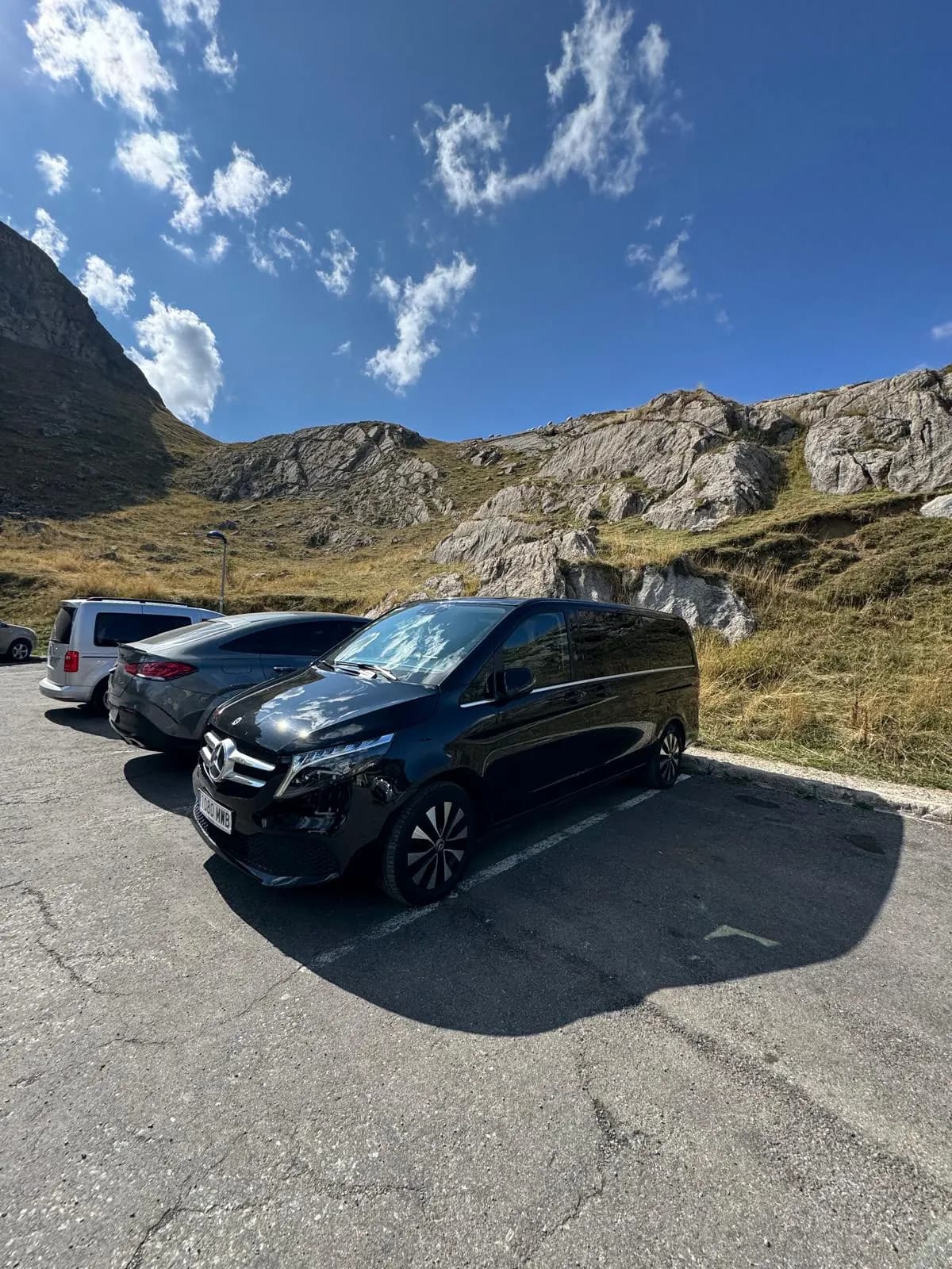 A QuickPickups fleet vehicle at a mountain pass